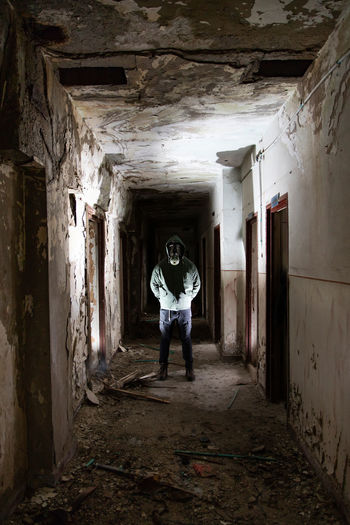 Man standing in abandoned building