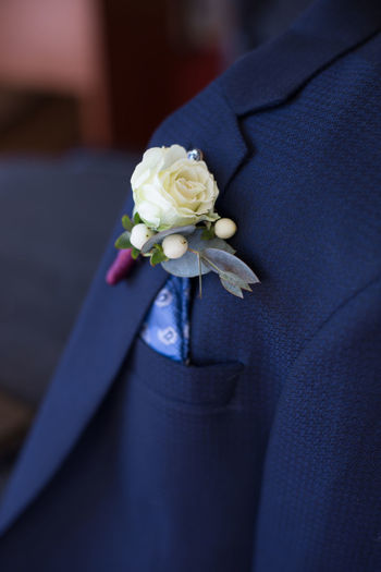 Close-up of rose in blue blazer