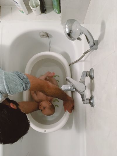 Midsection of man in bathroom at home