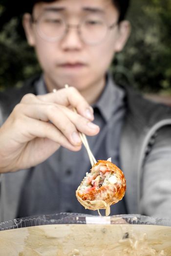 Close-up of man having food