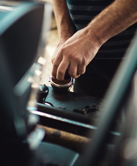 Close-up of man working on car