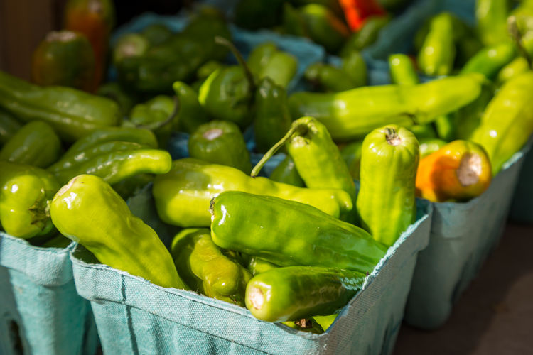 Close-up of green chili peppers for sale in market
