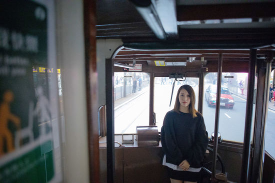 Portrait of woman standing in bus