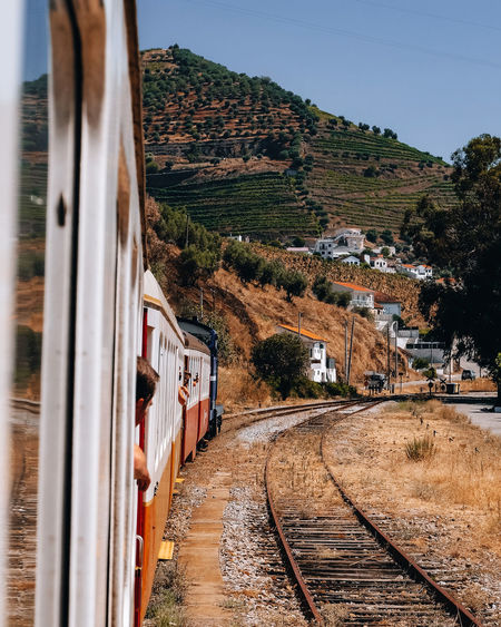 Train on railroad track against sky