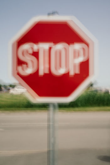 Blurred motion view of beach scene with stop sign