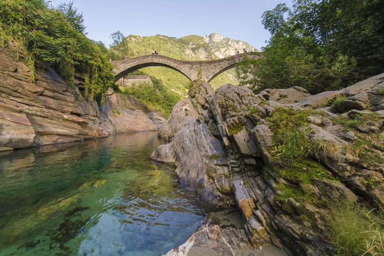Valle verzasca river with the stone bride and the crystal clear water