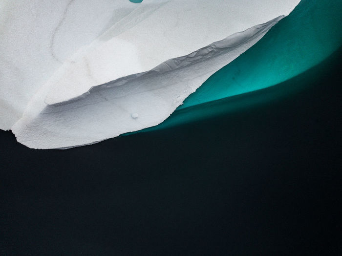 Aerial view of iceberg melting in sea