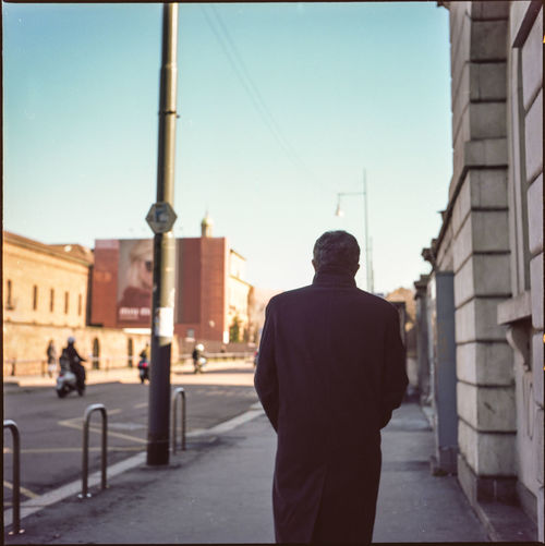 Man standing in front of building