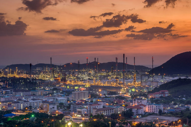 High angle view of illuminated city buildings during sunset
