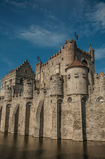 Stone wall and tower at the gravensteen castle in ghent. a city with gothic buildings in belgium.