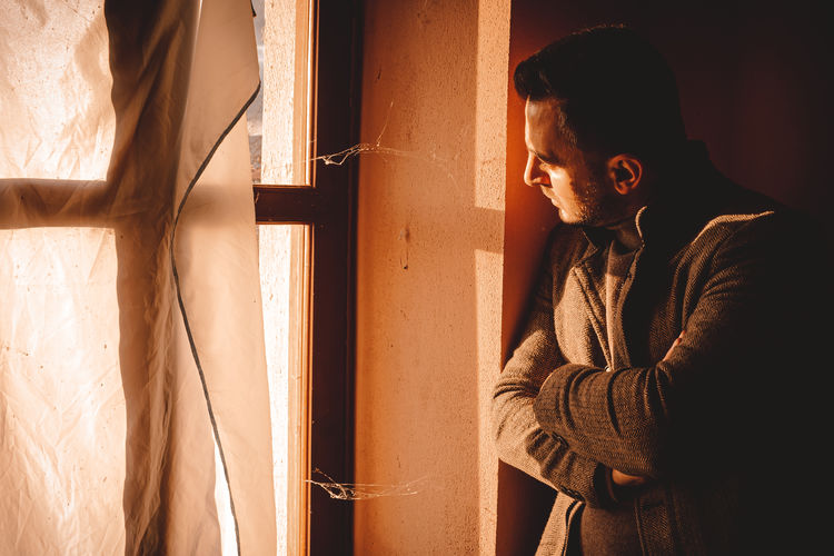 Man standing by window