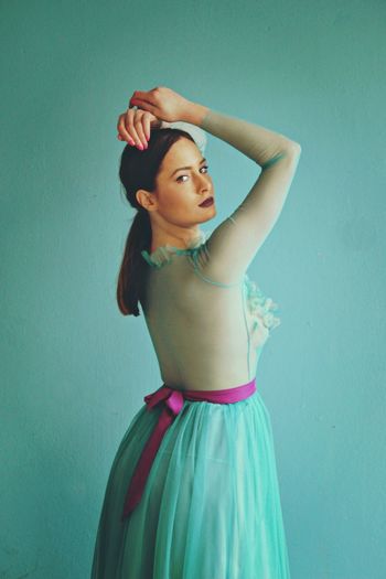 Portrait of beautiful fashion model against blue background
