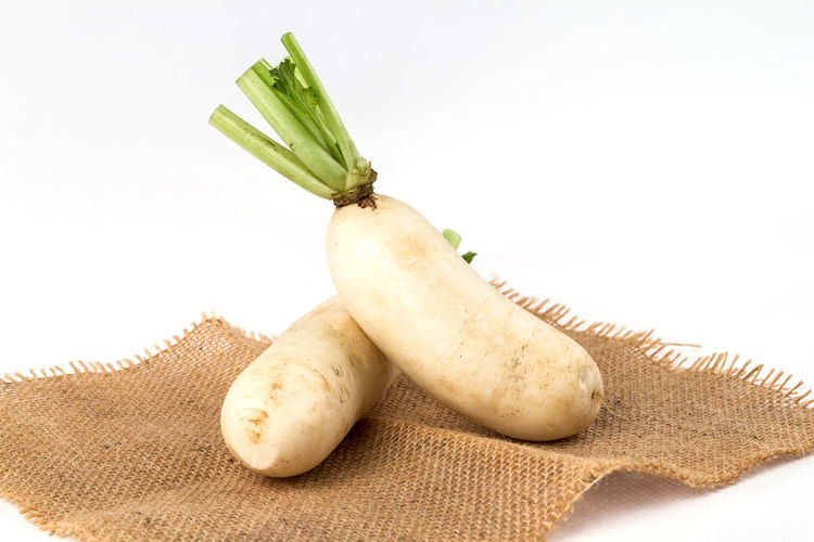 Close-up of fresh vegetables against white background