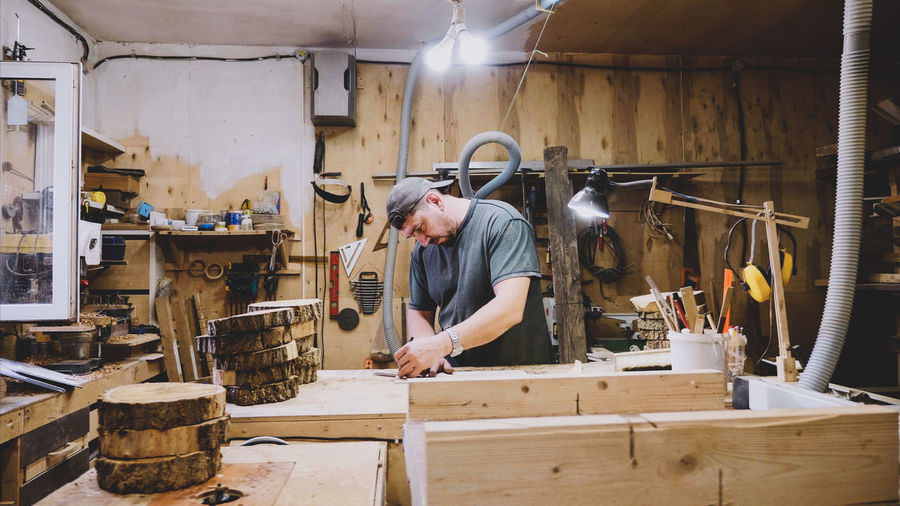 Carpenter working in factory