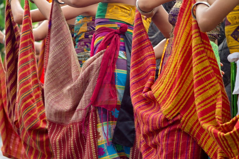 Low section of women hanging in traditional clothing