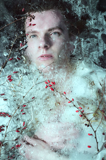 Close-up of man in frozen water