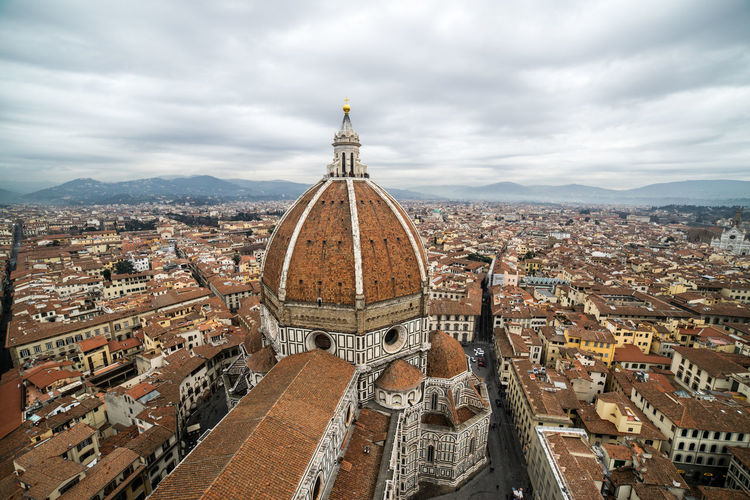 High angle view of townscape against cloudy sky