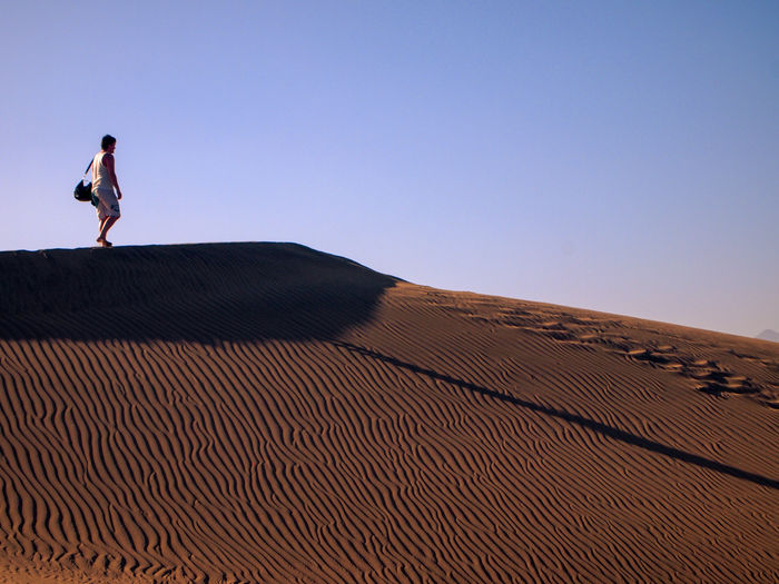 Man walking in the maspalomas sand dunes