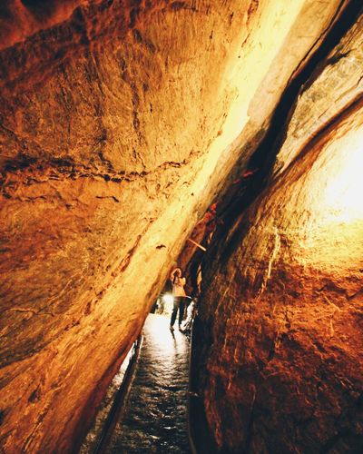 Woman standing in tunnel