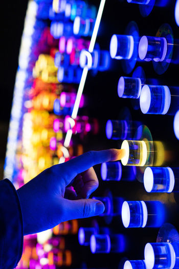 Cropped hand of scientist holding test tubes