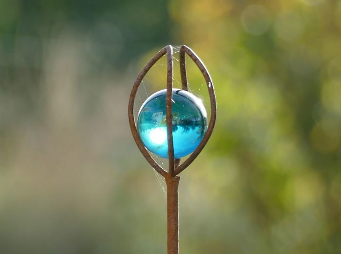 Close-up of cross against blurred background