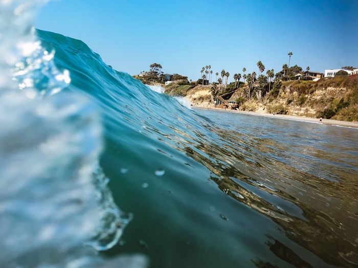 Bodysurfing a wave at swamis beach in encinitas, san diego, california