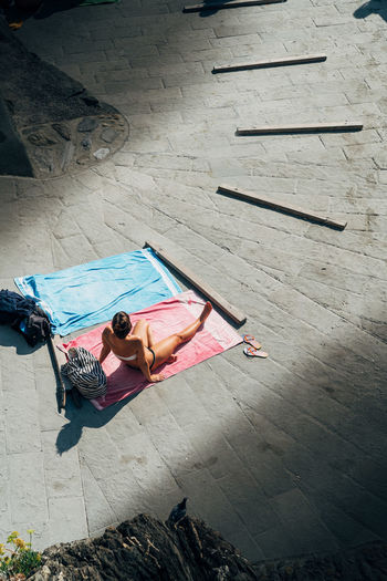 High angle view of woman sunbathing
