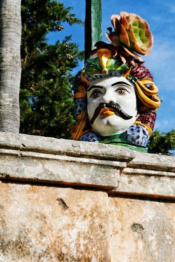 Low angle view of statue on wall
