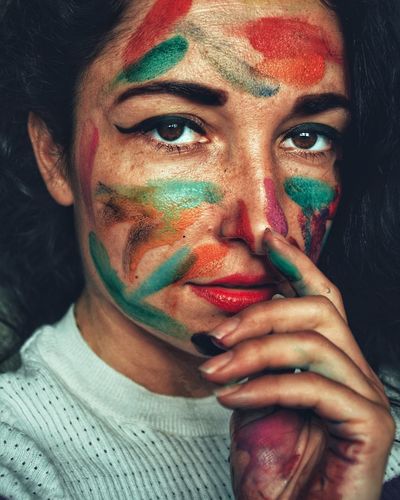 Close-up portrait of woman with face paint