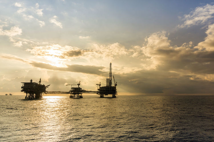 Seascape of an oil field during sunset at offshore terengganu oil field