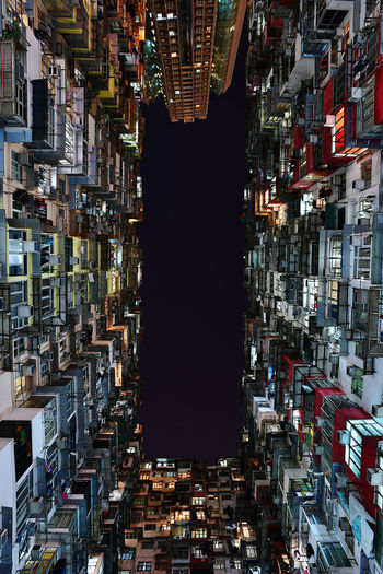 High angle view of illuminated buildings in city at night