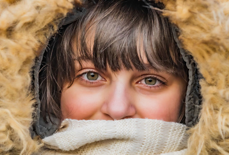 Close-up portrait of cute girl in winter