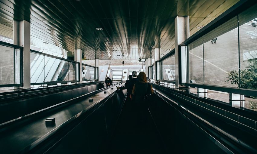 High angle view of people on escalator indoor