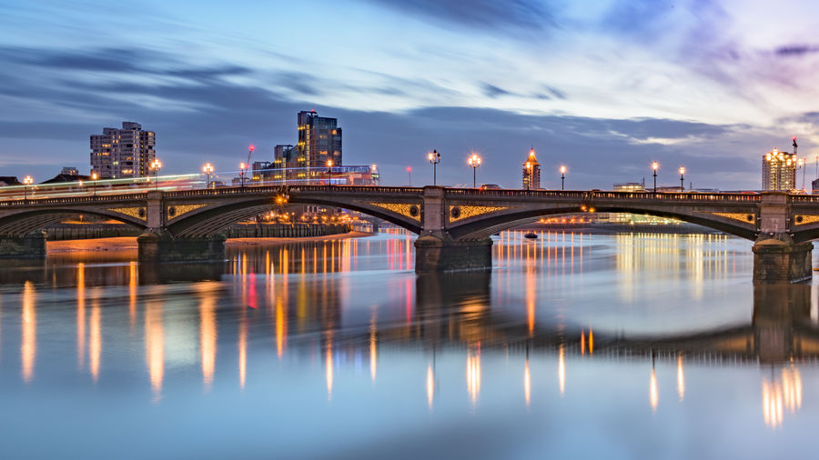 London battersea bridge and thames river during evening rush