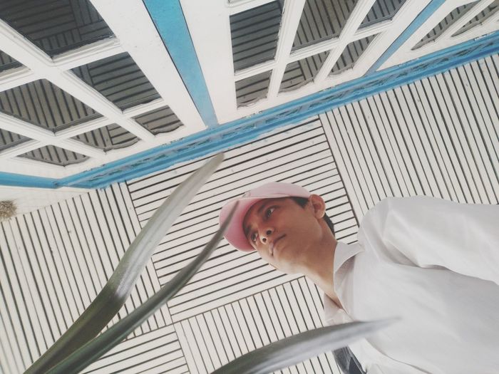 Low angle view of young man looking away