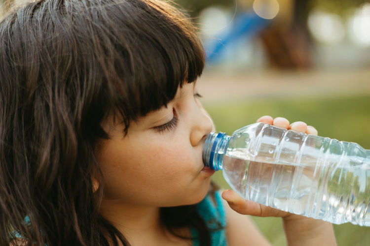Child drinking water from bottle