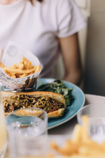 Midsection of woman having food