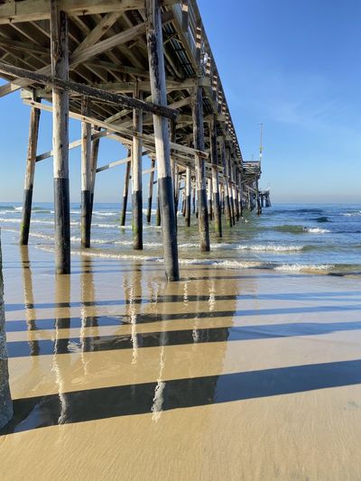 Pier over sea against sky