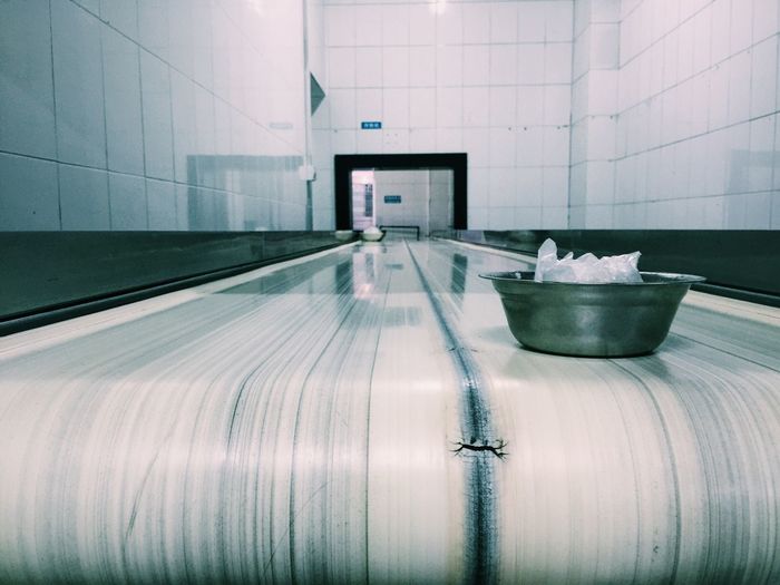 Bowl on conveyor belt in factory