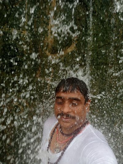 Portrait of a smiling man in water