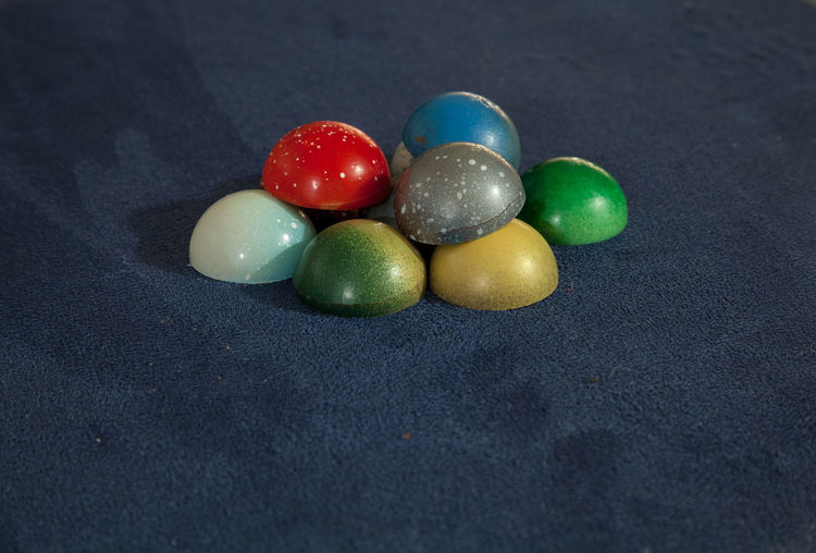 Close-up of multi colored easter egg on table