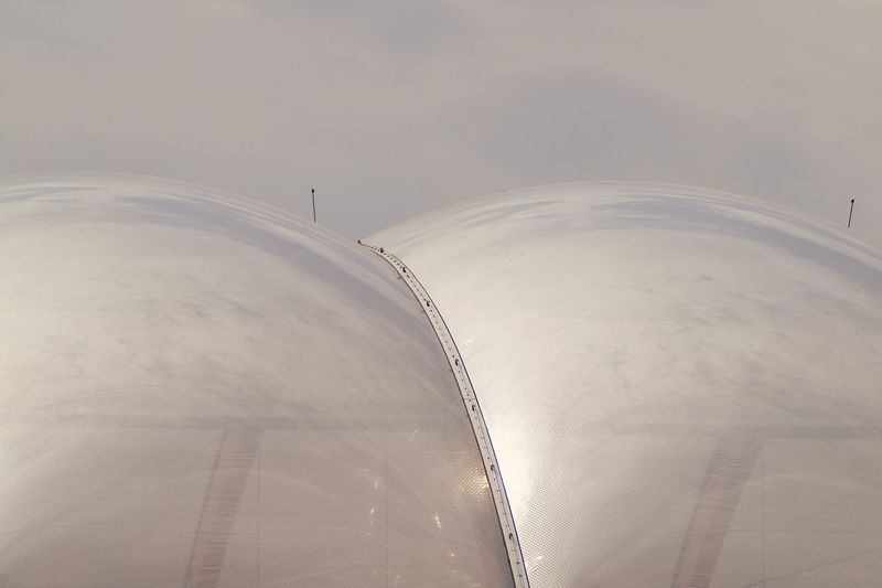 Low angle view of a modern dome against sky