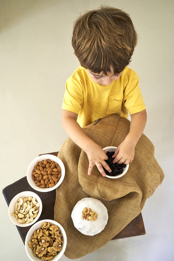 High angle view of woman preparing food on table