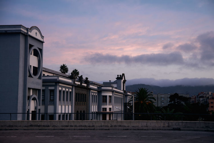 Building against sky at sunset