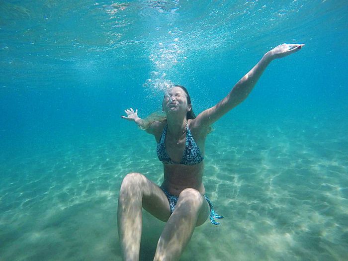 Woman diving underwater