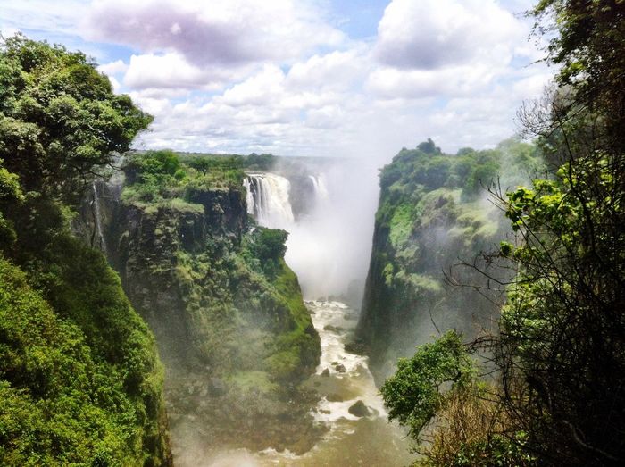 Scenic view of victoria falls against cloudy sky