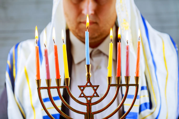 Midsection of man with menorah