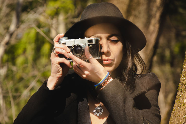 Portrait of woman photographing