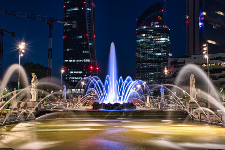 Colorful, stunning fountain of the four seasons at julius caesar square during the night