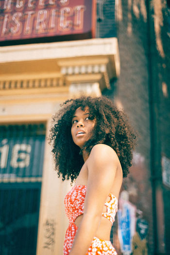Adult Architecture Beautiful Woman Beauty Curly Hair Day Leisure Activity Lifestyles One Person Outdoors People Portrait Real People Standing Young Adult Young Women